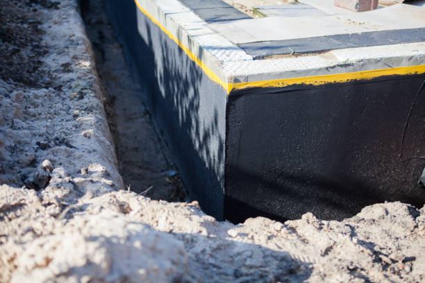Professional Waterproofing technician working in Dauphin Island, AL